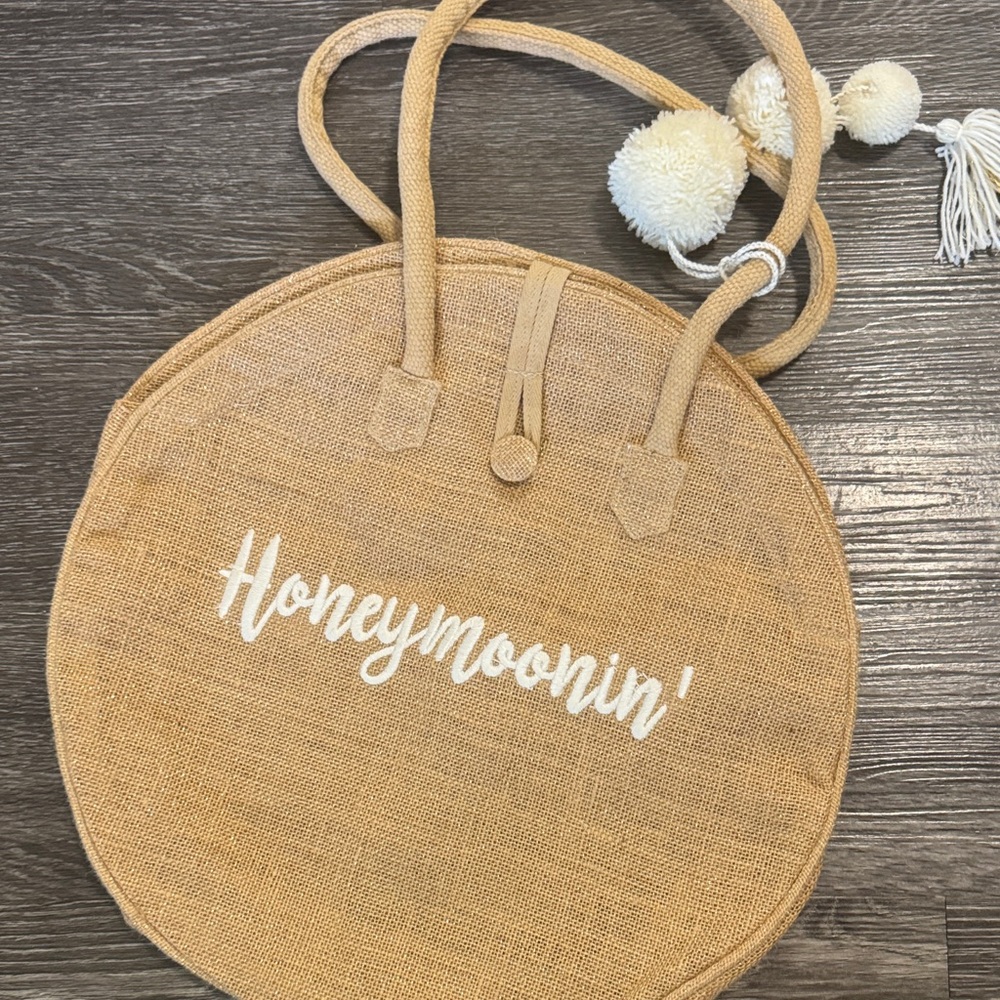 Round Tan Tote Bag with Pom Poms. 10available